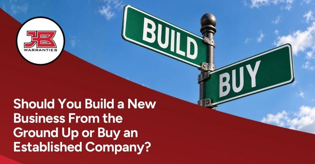 JB Warranties graphic featuring intersecting green street signs labeled “Build” and “Buy” against a blue sky. The headline reads, “Should You Build a New Business From the Ground Up or Buy an Established Company?”
